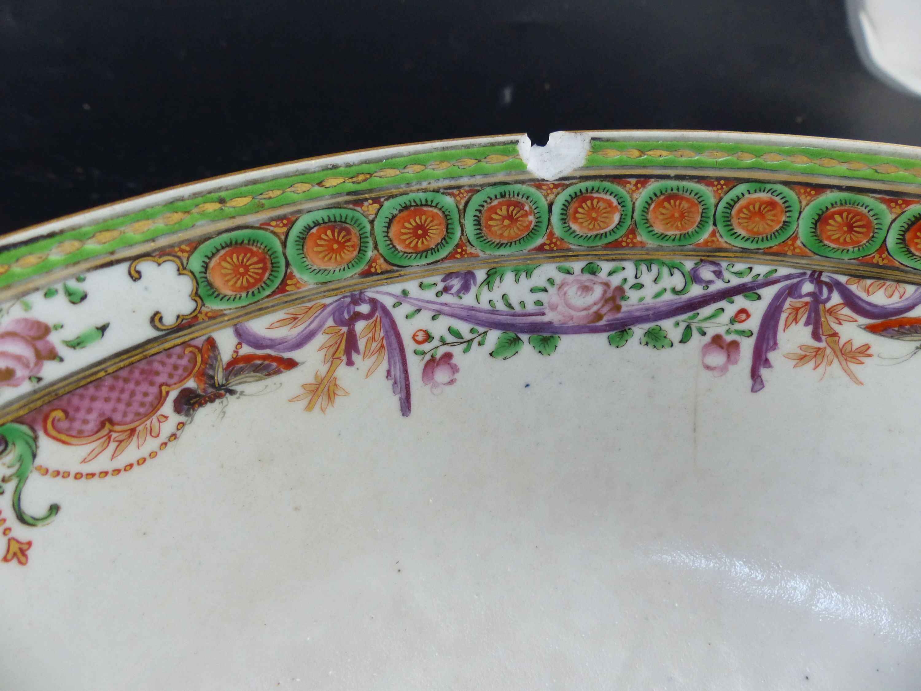 A pair of famille rose punch bowls, Qing dynasty, 18th century, diameter 29cm (both a.f.)